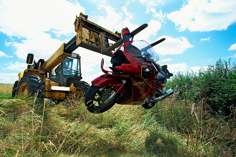 A crashed motorcycle is recovered