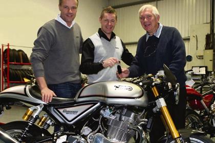 Garner (left) and Walker hand over the keys to the first Norton Cafe Racer owner