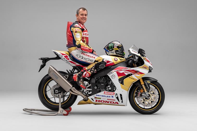 John McGuinness sitiing on a Honda Fireblade replica of his 100th TT start racer