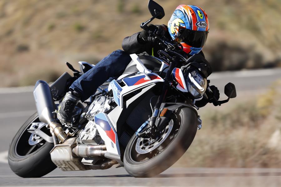 BMW M1000R turning left on the road