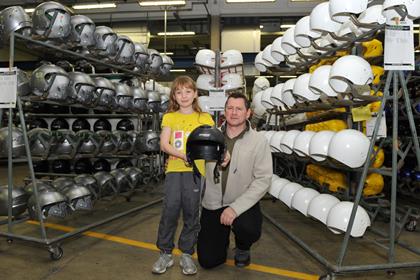 John and Chloe-Ann Mair in amongst the helmet moulds in the Nolan factory