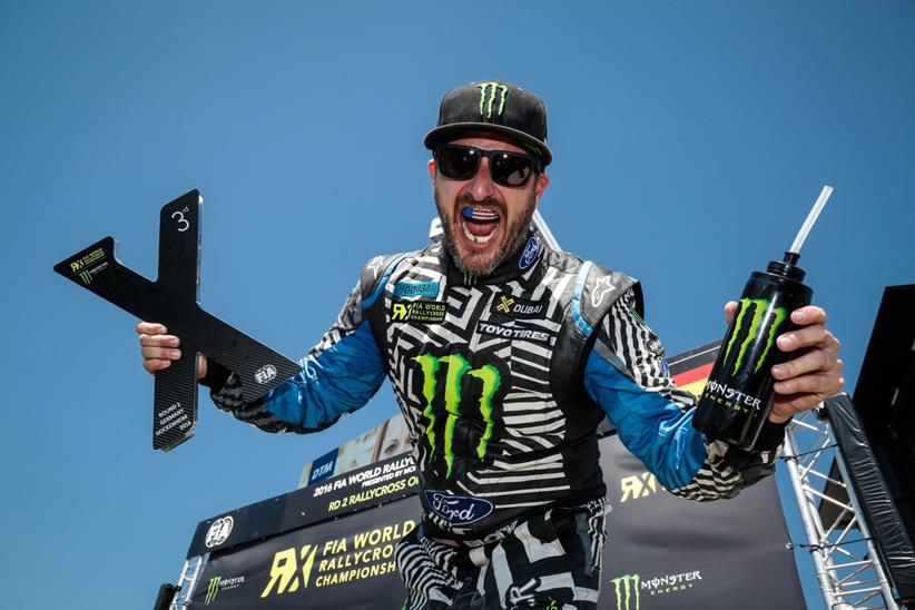 Ken Block posing with an X-Games trophy