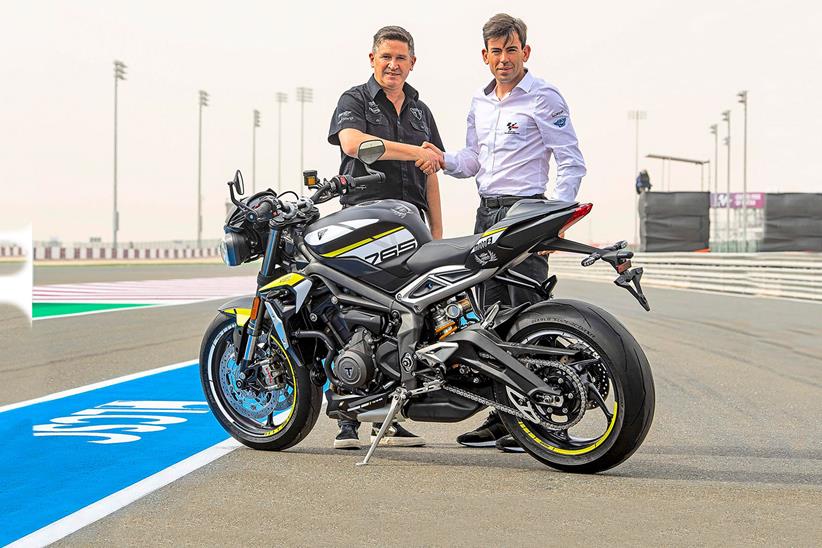 Triumph's Steve Sargent with Dorna’s Carlos Ezpeleta