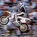 Robbie Knievel jumping a Honda CR500 in front of a crowd