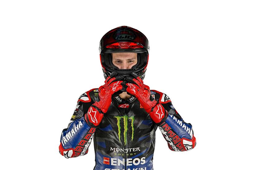 Fabio Quartararo puts his helmet on during the 2023 Yamaha livery reveal