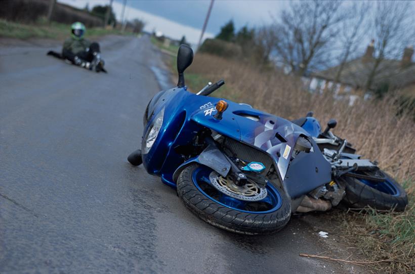 Motorbike on its side after crash