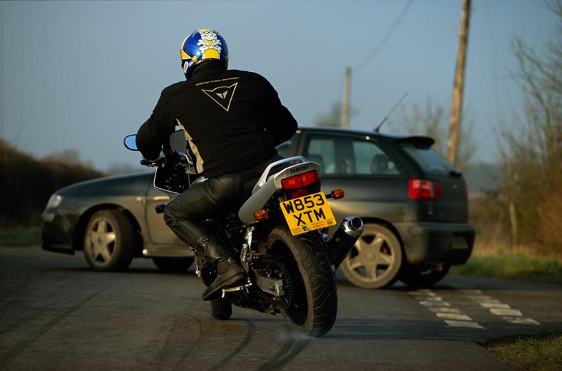 Motorbike skidding after car pulled out of junction