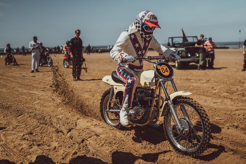 Classic bike accelerating on sand