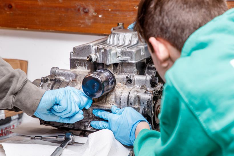 Young person learning to be a mechanic