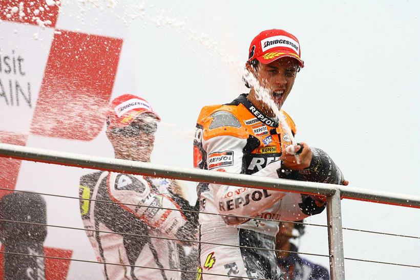 Andrea Dovizioso celebrates on the podium at Donington Park in 2009