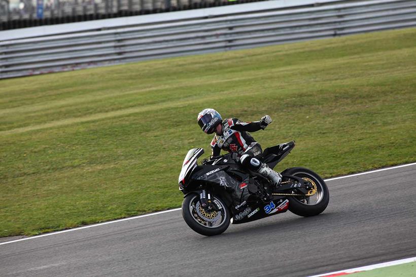 Alastair Seeley celebrates his Supersport title in 2011