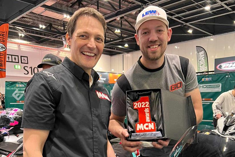 Michael Guy presents Peter Hickman with the MCN Rider of the Year 2022 trophy