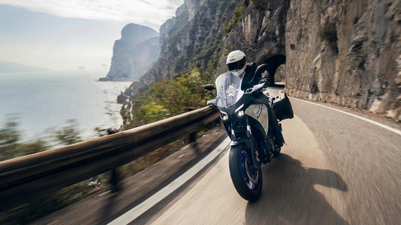 2023 Yamaha Tracer 7 GT carving round a mountain bend