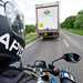 A motorcyclist preparing to overtake a lorry
