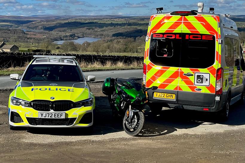 Kawasaki Ninja H2 SX with police patrol car and speed van