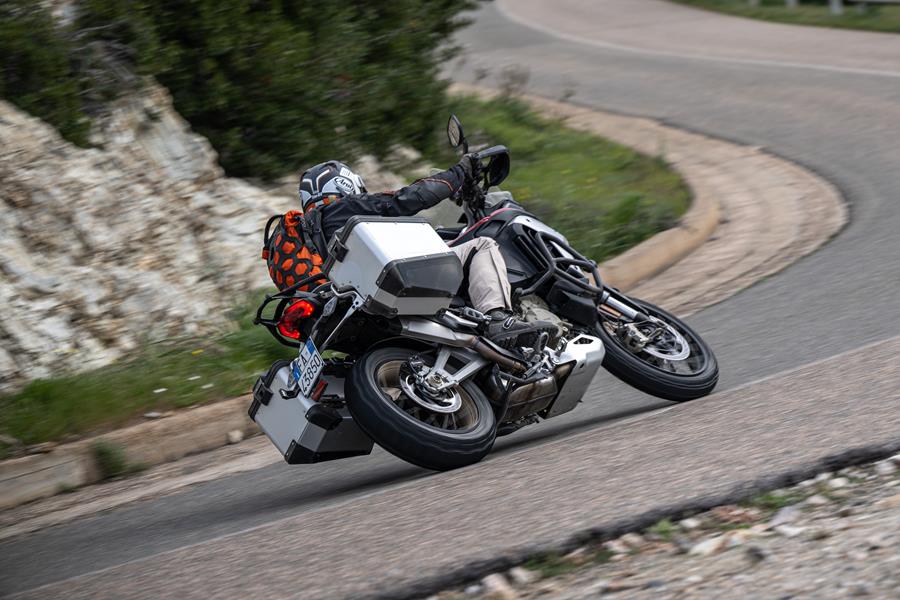 Ducati Multistrada V4 Rally turning left from rear