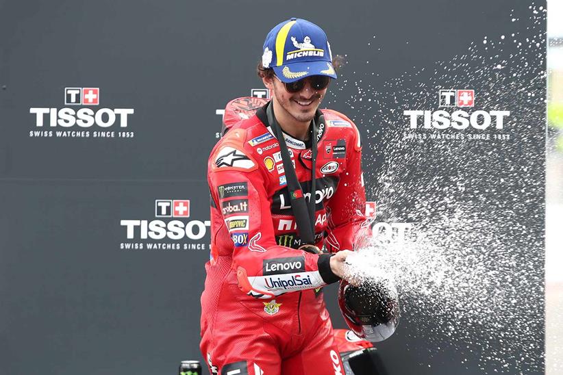 Pecco Bagnaia sprays the champagne after winning the Portimao Sprint Race