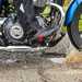 Motorcycle splashes through a pothole in the UK