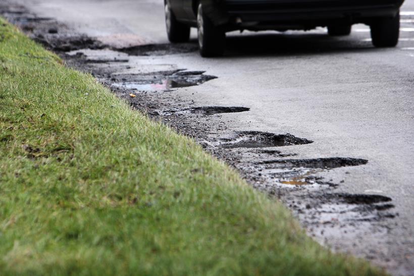 Potholes along the edge of a road