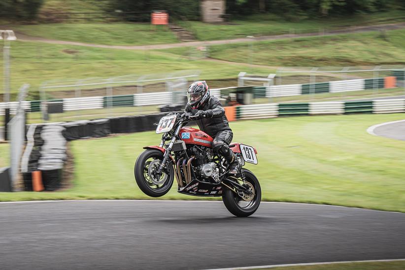 Pulling a wheelie over the Mountain at Cadwell Park