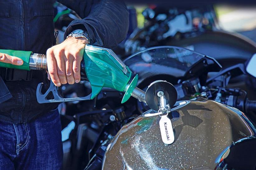 Filling a motorcycle with petrol