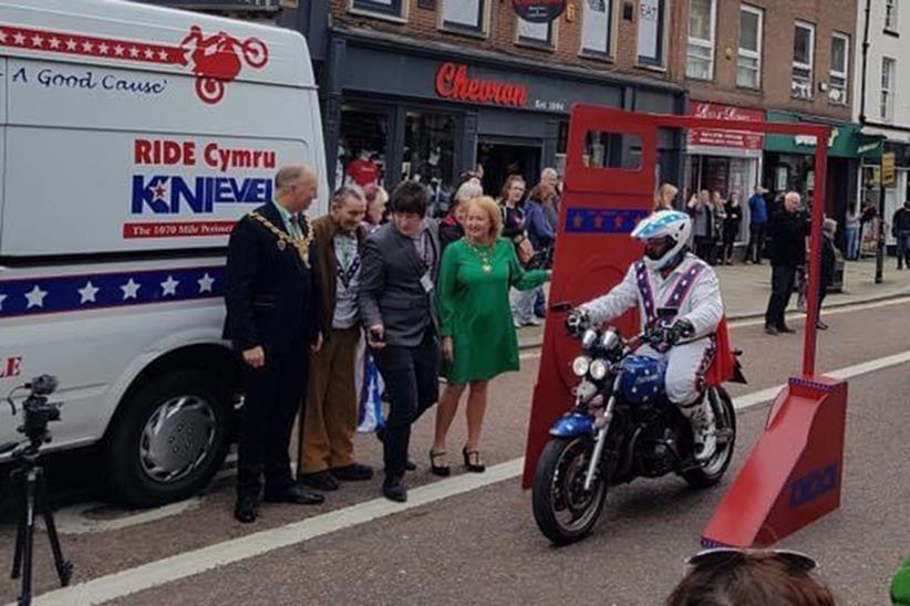 A rider on the Knievel charity day passes through the energiser