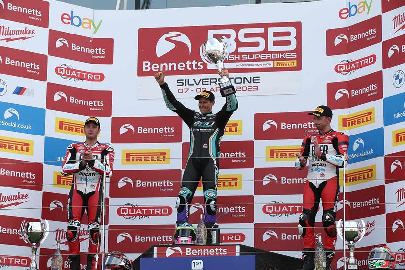 Josh Brookes celebrates victory at Silverstone alongside Tommy Bridewell and Glenn Irwin