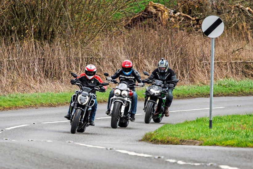 Three 2023 muscle bikes riding on a UK national speed limit road