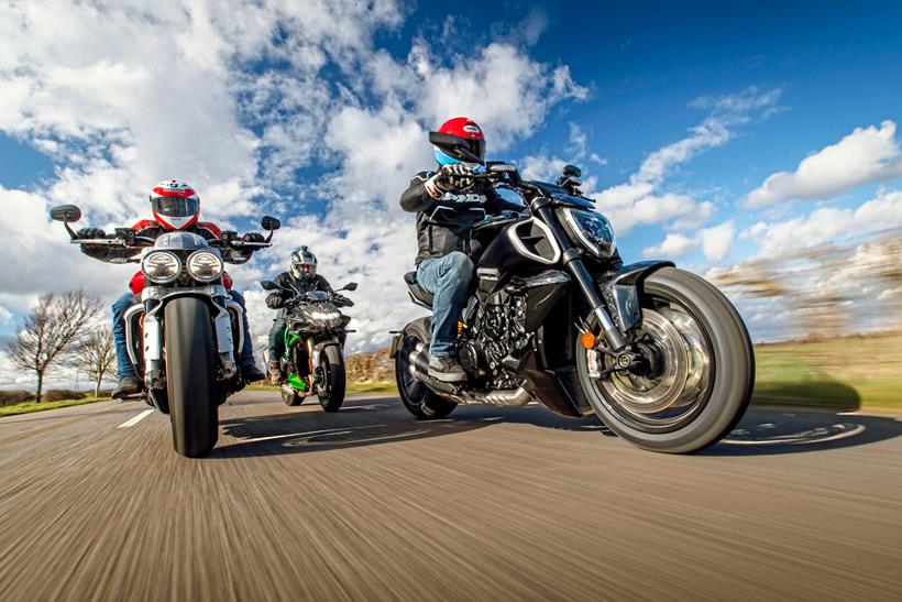 The Ducati Diavel V4, Triumph Rocket 3 R and Kawasaki Z H2 riding on a road