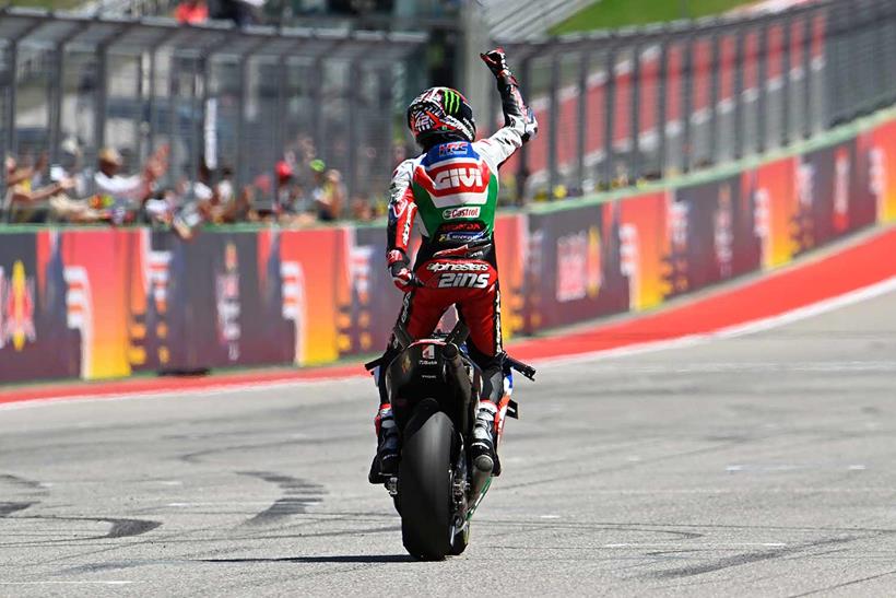 Alex Rins crosses the line to win at COTA