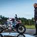 Ben Clarke stands with the BMW M1000R long-term test bike
