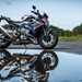 BMW M1000R long-term test bike reflected in a puddle