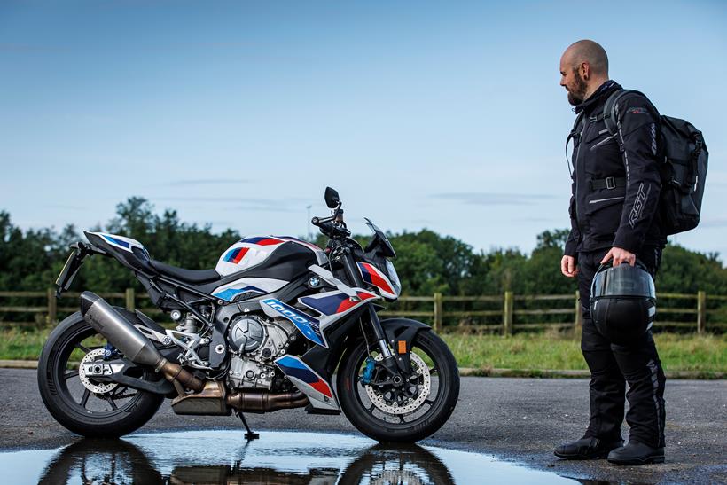 Ben Clarke stands with the BMW M1000R long-term test bike