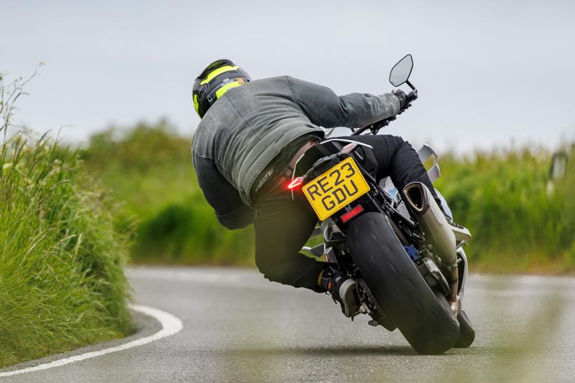 BMW M1000R cornering on the road