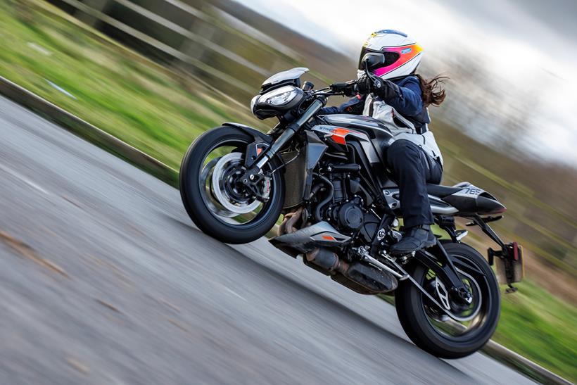 Triumph Street Triple 765 RS cornering in the wet