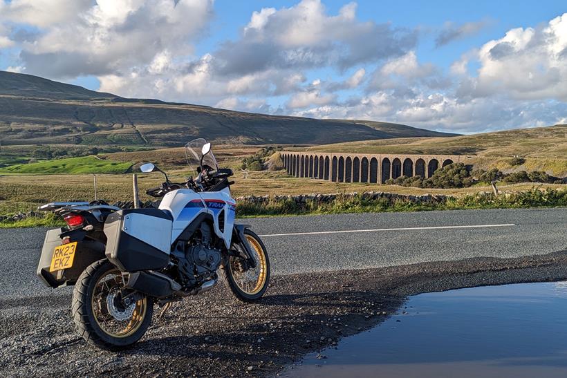 Honda XL750 Transalp long-term test bike in front of viaduct