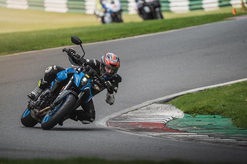 Cornering left at Cadwell Park on a Suzuki GSX-8S