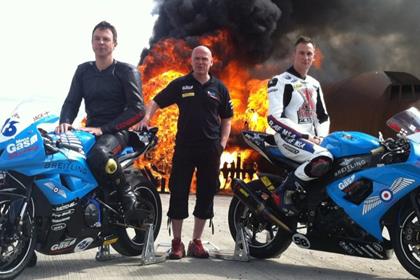 Left to right: Team manager Paul Taylor, mechanic Adrian Cox and rider ‘Jack’ Russell