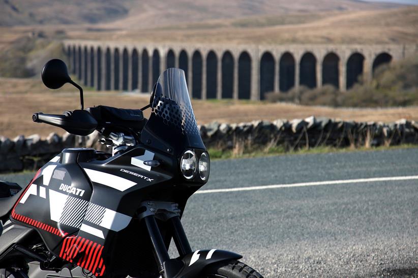 Ducati DesertX with viaduct in background