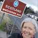 Ali Silcox with the welcome to Scotland sign