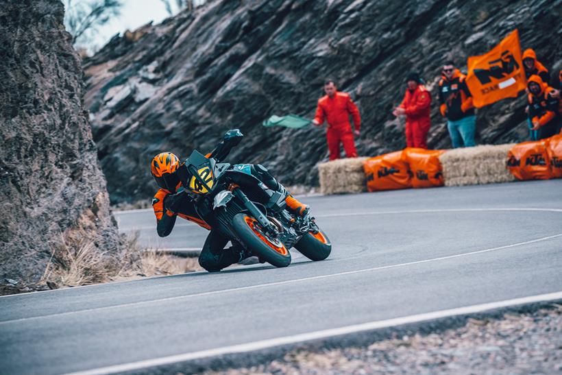 Cornering knee down on the 2023 KTM 890 SMT