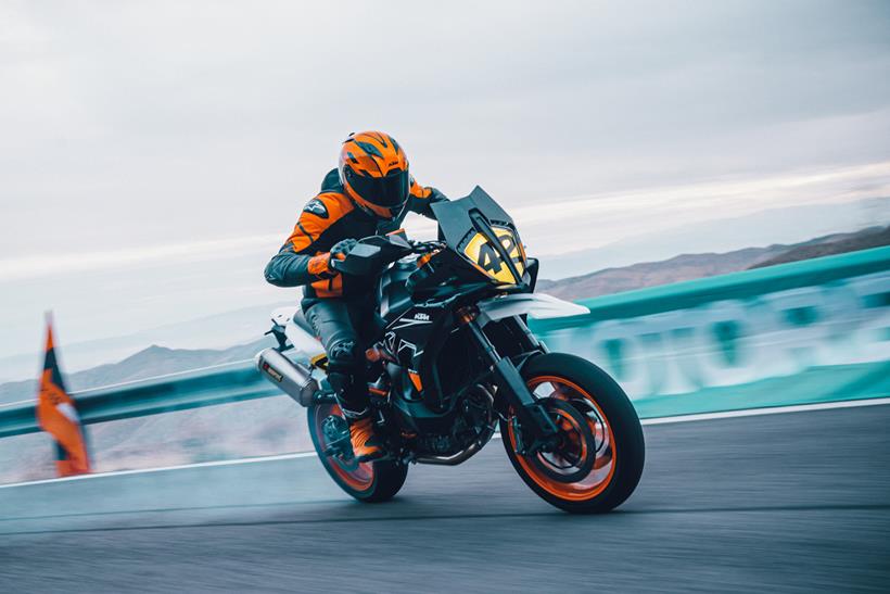 Sliding the rear wheel on the 2023 KTM 890 SMT