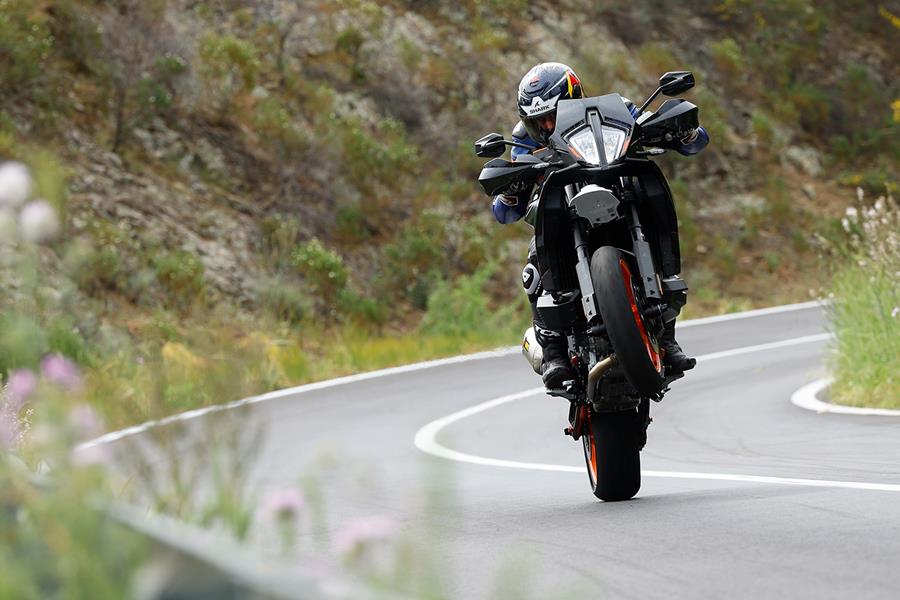 KTM 890 SMT wheelie performed on a closed road