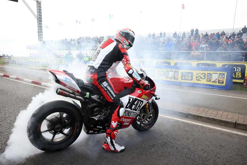 Glenn Irwin celebrates Superbike success with a burnout. Photo Stephen Davison/Pacemaker Press