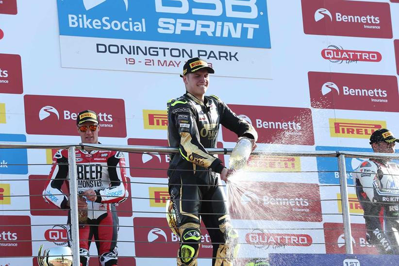 Kyle Ryde celebrates victory on the podium at Donington Park