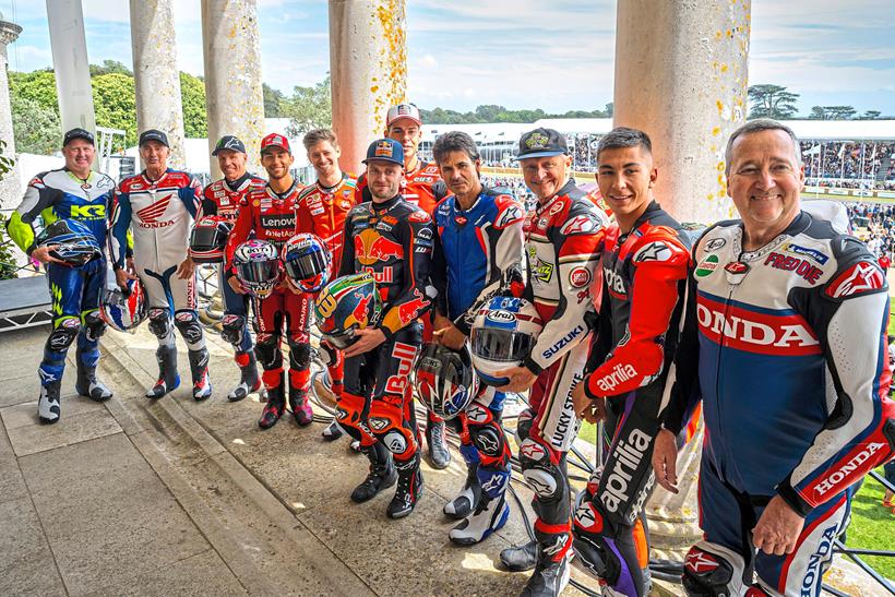 A line-up of top motorcycle racers past and present on the balcony at Goodwood. Credit: Oli Tennent