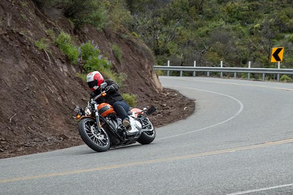 Harley-Davidson Breakout cornering quickly on a twisty road