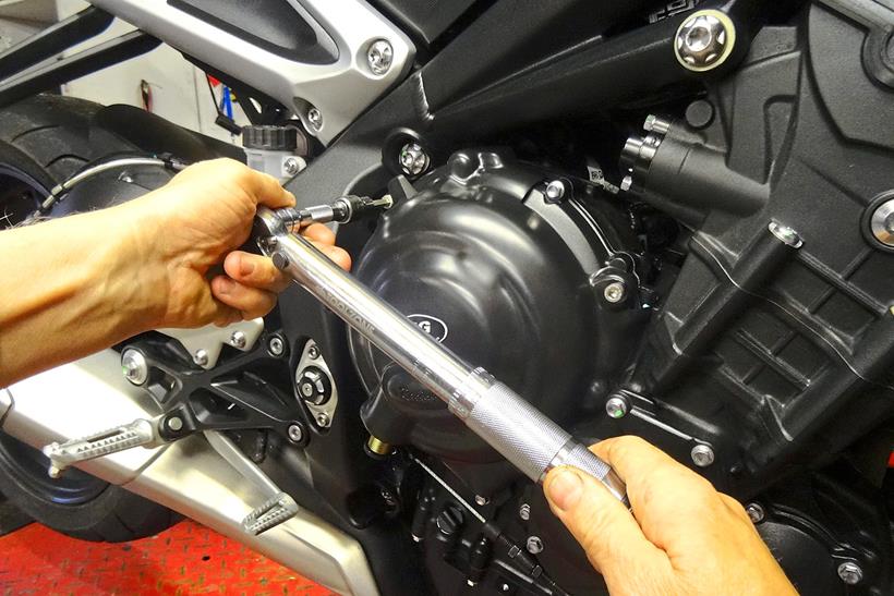 Using a torque wrench to fit motorbike crash protection