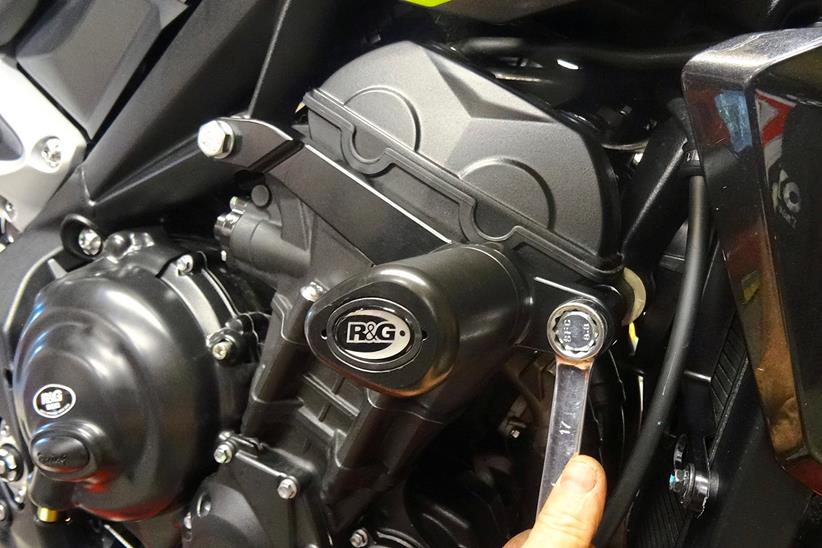 Using a spanner to fit motorcycle crash protection