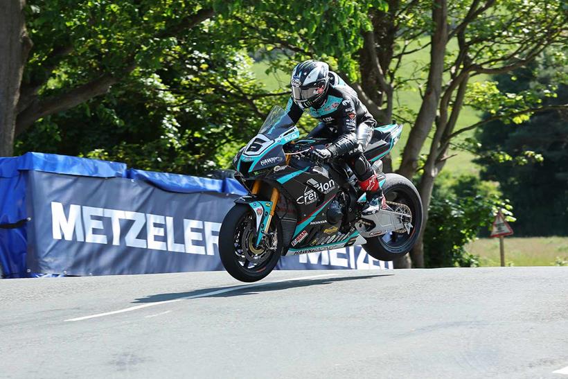 Michael Dunlop (1000 Honda/Hawk Racing) at Ballaugh Bridge during the RST Isle of Man TT Superbike race. (Pacemaker Press / Dave Kneen)